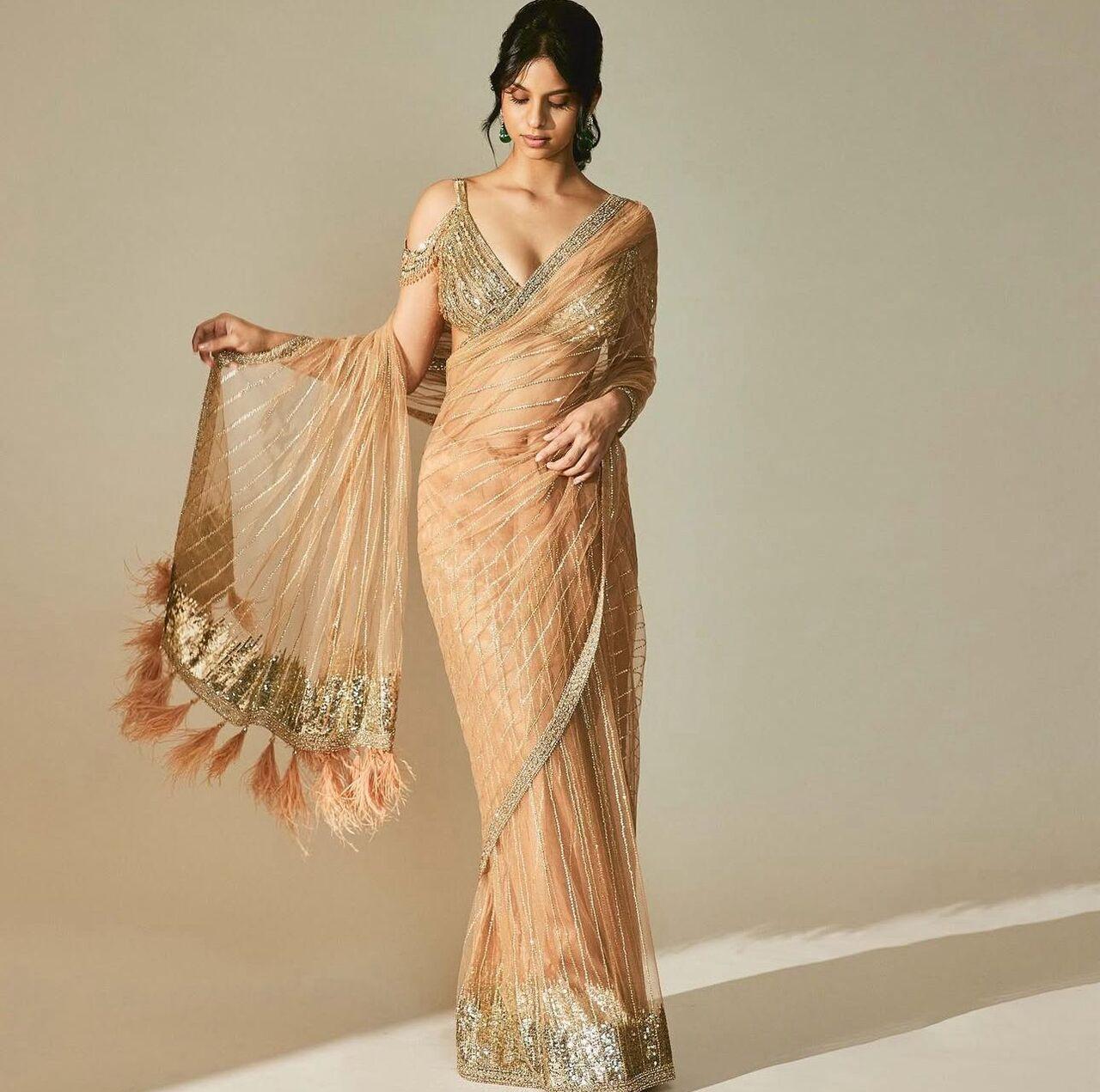 Suhana goes soft and sophisticated with a light orange-beige saree. Perfect for those who prefer understated glam, her look proves that Navratri style can be both simple and stunning.